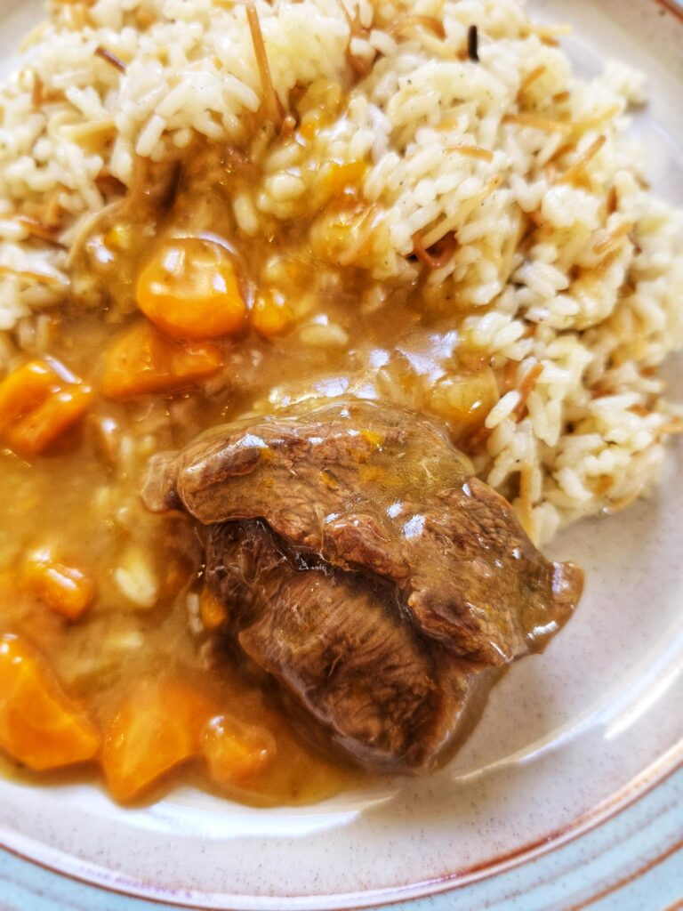 plate of greek food beef lemonato with white rice