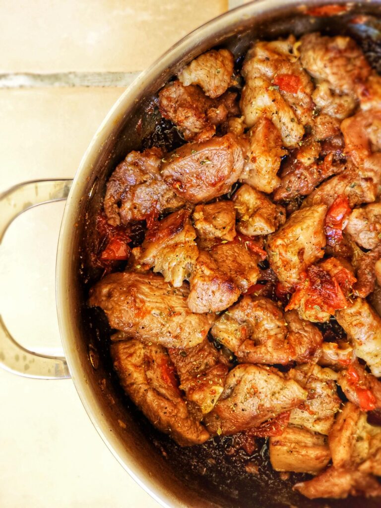 a pan of yummy greek marinated pork belly in beer